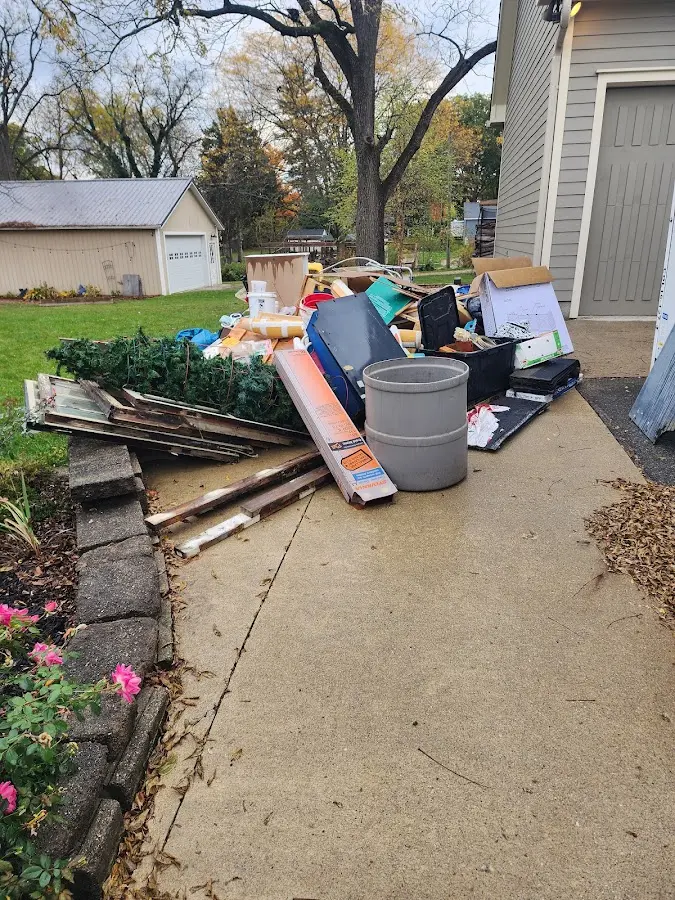 Dumpster being loaded with debris for Estate Cleanout Dumpster Rental in Forestville